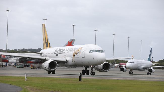 Multiple flights have been delayed after Sydney Airport cancelled more than 100 flights due to extreme weather. Photo: Brendan Radke.