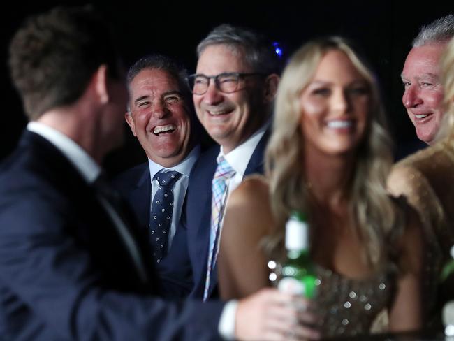 Lachie Neale shares a laugh with coach Chris Fagan, chairman Andrew Wellington and CEO Greg Swann (far right) during the 2020 Brownlow Medal count.