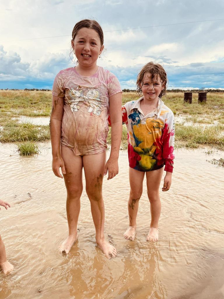 Emily and Taylor Geltch at Scotstoun after a heavy little storm dropped 67mm. Picture: Kerryn Geltch/Who Got Rain Facebook page