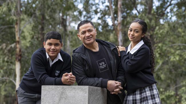 Ola Loau and his two kids Olina, 16, and Ezra, 14, who attend Bossley Park High School. Picture: Matthew Vasilescu