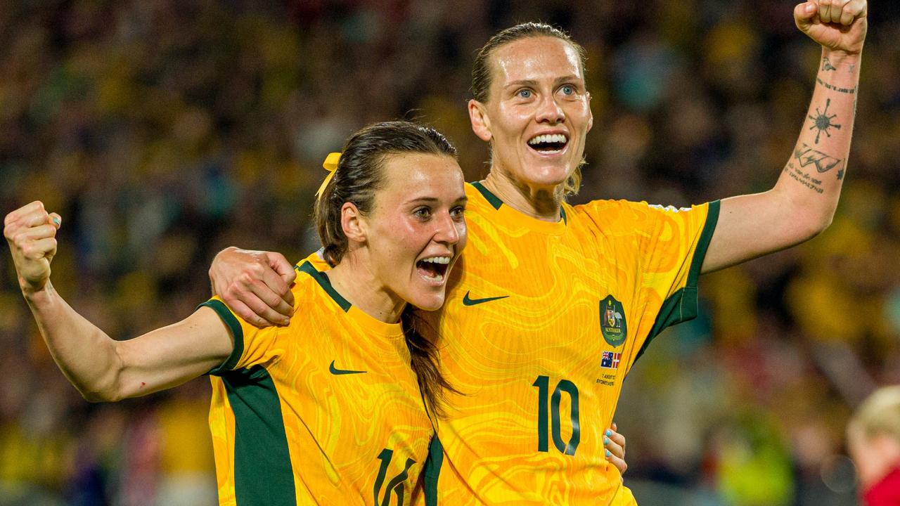 Hayley Raso celebrates with Emily van Egmond. Photo by Andy Cheung/Getty Images.