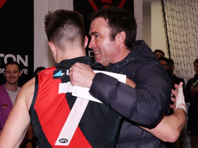 MELBOURNE, AUGUST 4, 2024: 2024 AFL Football - Round 21 - Essendon Bombers V Fremantle Dockers at the MCG. Brad Scott coach of the Bombers celebrates the win with Zach Merrett of the Bombers. Picture: Mark Stewart