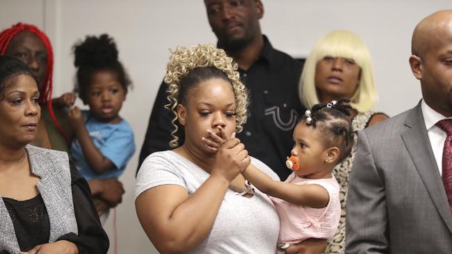 Tomika Miller, the wife of Rayshard Brooks, holds their daughter, Memory, 2, during the family press conference in Atlanta. Picture: AP