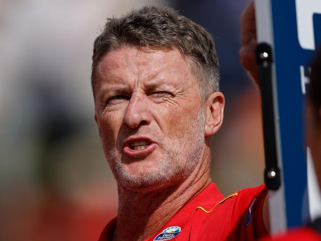 ADELAIDE, AUSTRALIA - APRIL 07: Damien Hardwick, Senior Coach of the Suns addresses his players at water time during the 2024 AFL Round 04 match between the Gold Coast SUNS and GWS GIANTS at Adelaide Hills - Mt Barker on April 07, 2024 in Adelaide, Australia. (Photo by Dylan Burns/AFL Photos via Getty Images)