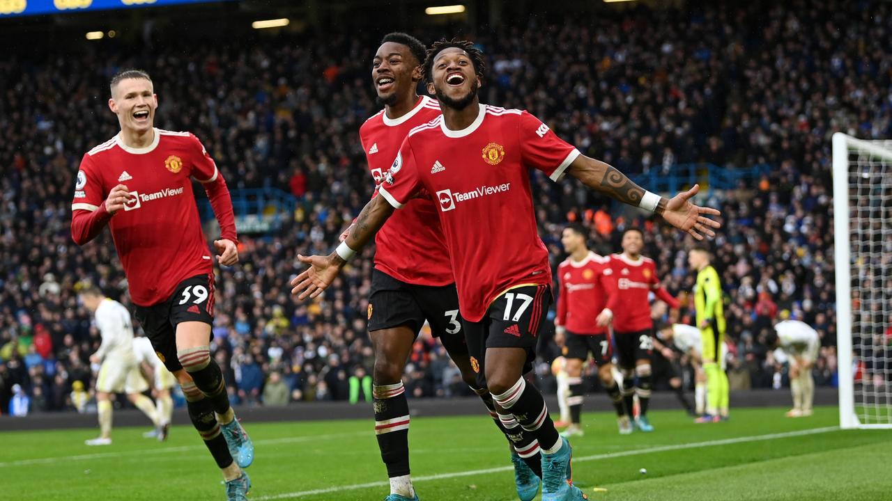 LEEDS, ENGLAND - FEBRUARY 20: Fred celebrates with Anthony Elanga and Scott McTominay of Manchester United after scoring their team's third goal during the Premier League match between Leeds United and Manchester United at Elland Road on February 20, 2022 in Leeds, England. (Photo by Shaun Botterill/Getty Images)