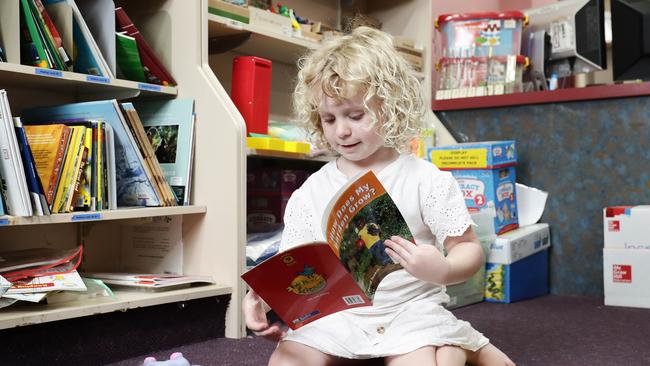 Ariya Buckley, 3, of Bentley Park, casts her inquisitive eyes over some books at Harleys Educational Superstore in Manunda. Picture: Brendan Radke