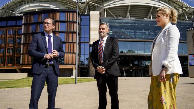 SA Premier Steven Marshall (left), SA Health Dr Emily Kirkpatrick (right) and SACA CEO Keith Bradshaw outside Adelaide Oval. Picture: Mike Burton