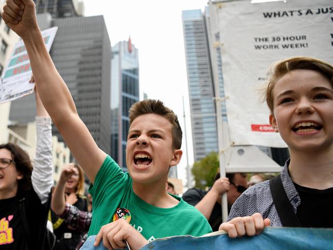 Protesters are seen during the Climate Crisis National Day of Action rally in Sydney, Saturday, February 22, 2020. A Climate Crisis National Day of Action on February 22 will see demonstrations in 14 locations across Australia. (AAP Image/Bianca De Marchi) NO ARCHIVING