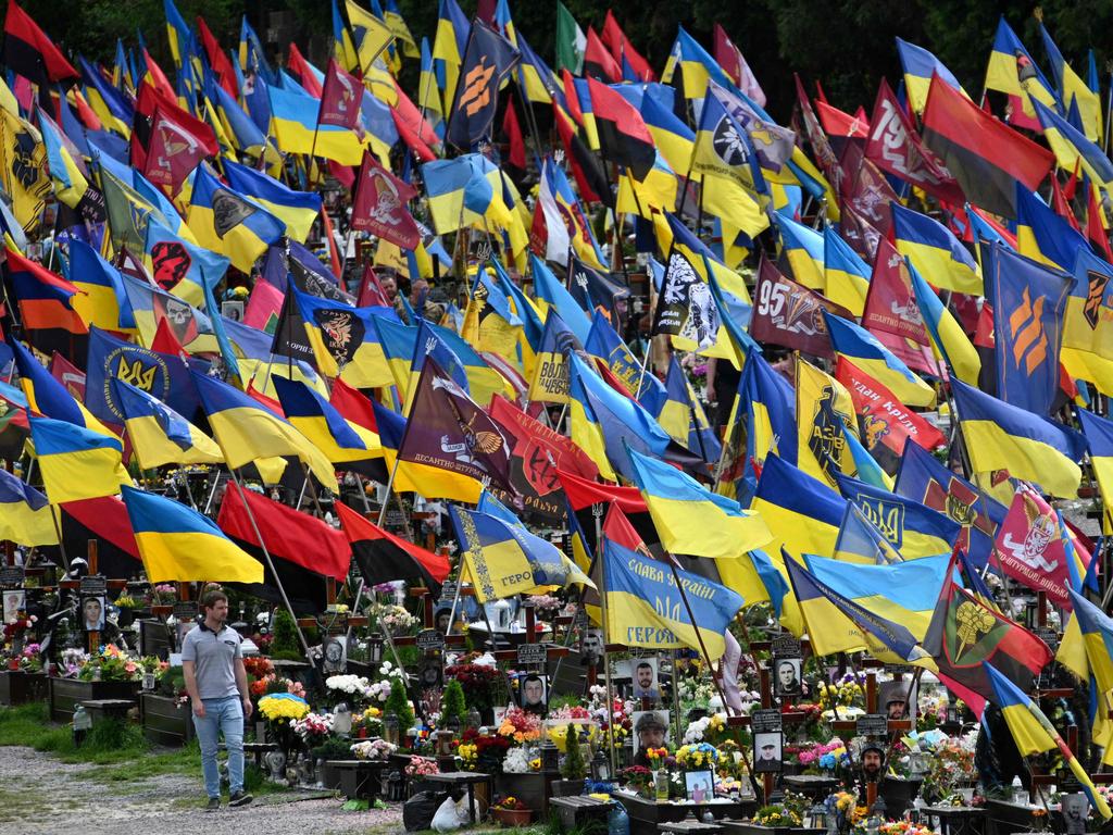 A local resident visits the Lychakiv cemetery in Lviv, Ukraine. Picture: Yuriy Dyachyshyn/AFP