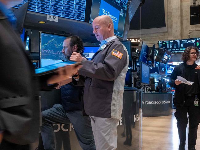 NEW YORK, NEW YORK - NOVEMBER 12: Traders work on the New York Stock Exchange (NYSE) floor on November 12, 2024 in New York City. After closing at record highs yesterday, the Dow was down slightly in morning trading.   Spencer Platt/Getty Images/AFP (Photo by SPENCER PLATT / GETTY IMAGES NORTH AMERICA / Getty Images via AFP)