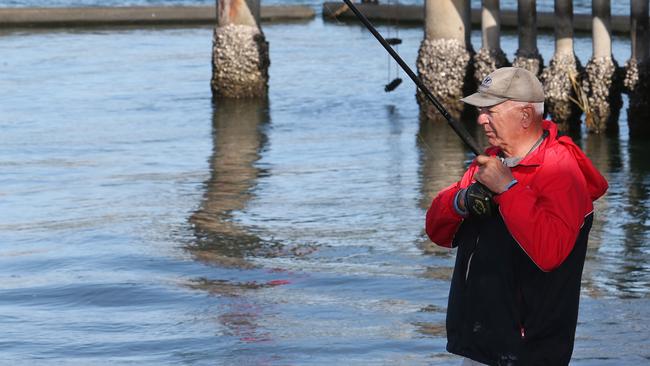 Burnie Upton fishing for luderick in the Tweed River. Photo: Mike Batterham