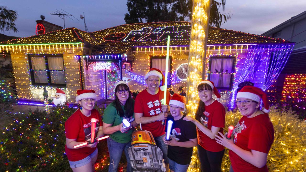 Andrew and Kylie Walters with kids Amy (18), Liana (16), Emelia (14) and Thomas (11) have a Star Wars Xmas themed light display every year at their Warradale home. Picture: Kelly Barnes. Picture: Kelly Barnes