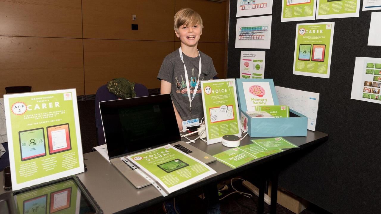 Lucas Buchanan with a display explaining his winning invention, MemoryBuddy, which aims to help people living with dementia. Picture: supplied
