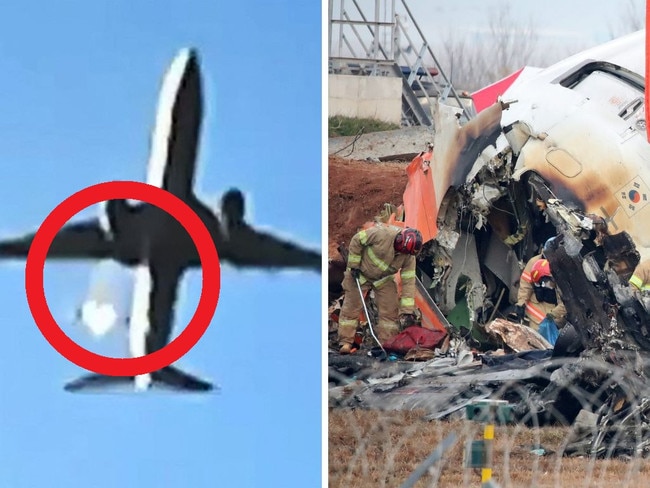 Firefighters work at the wreckage of a passenger plane at Muan International Airport on December 30, 2024 in Muan-gun, South Korea.