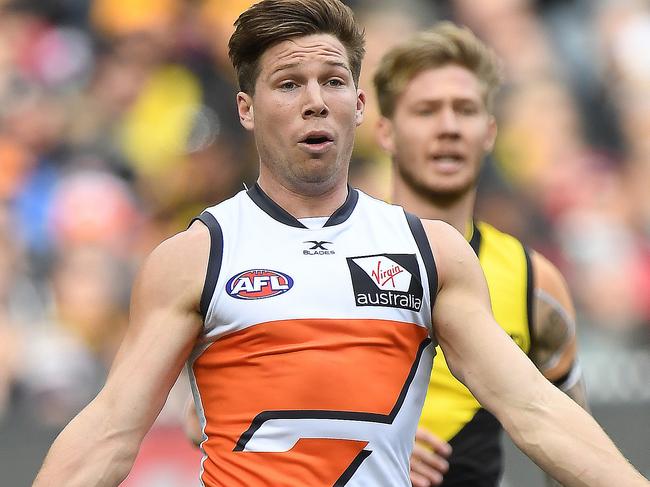 Toby Greene of the Giants (left) is seen in action during the Round 18 AFL match between the Richmond Tigers and the Greater Western Sydney Giants at the MCG in Melbourne, Sunday, July 23, 2017. (AAP Image/Julian Smith) NO ARCHIVING, EDITORIAL USE ONLY