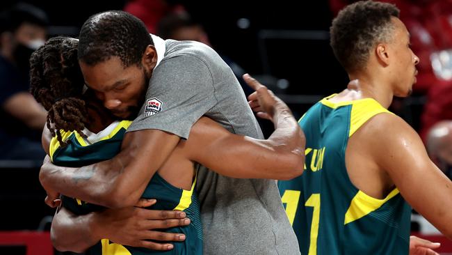 Brooklyn’s Patty Mills hugs new teammate Kevin Durant. Picture: Getty Images