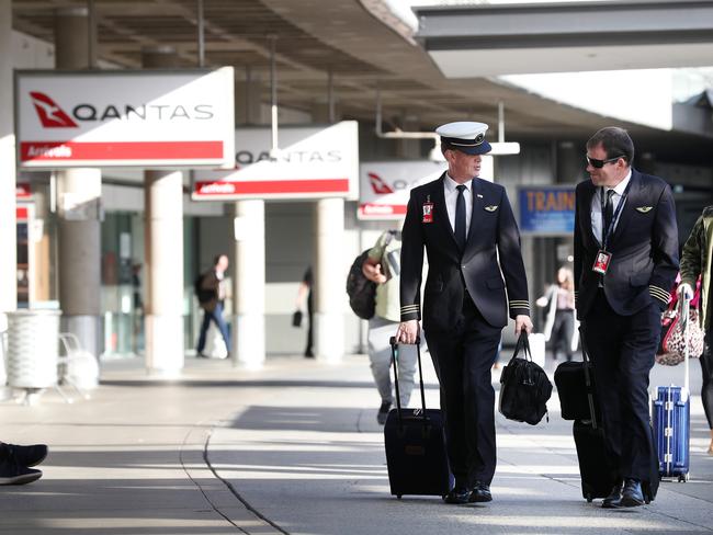 Pilots at Brisbane airport. There are fears job losses at Qantas could create more employment losses throughout the industry. Picture: Liam Kidston