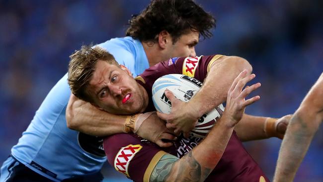 Jimmy the Jet gets hold of Cameron Munster. (Cameron Spencer/Getty Images)