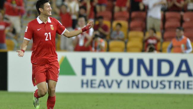 China's Yu Hai gestures to the crowd as he celebrates after scoring a goal during the first round soccer match of the AFC Asia Cup between China and Saudi Arabia in Brisbane, Australia, Saturday, January 10, 2015. (AP Photo/Steve Holland)