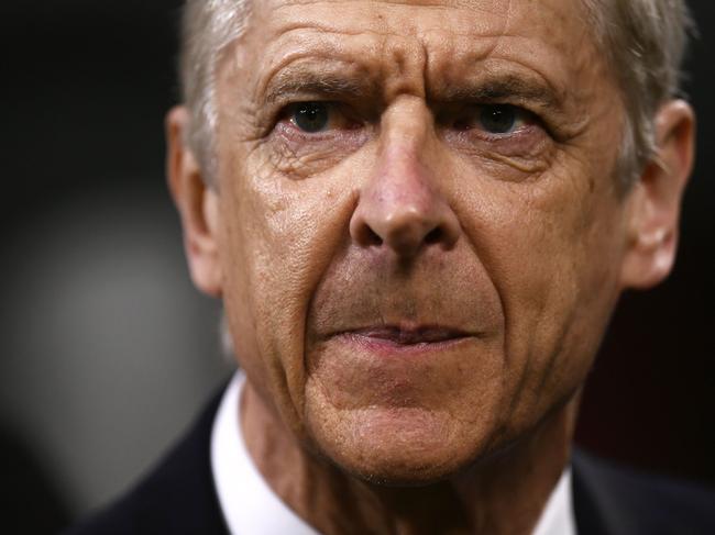 (FILES) In this file photo taken on March 08, 2018 Arsenal's coach Arsene Wenger looks on during the UEFA Europa League round of 16 first-leg football match AC Milan Vs Arsenal at the 'San Siro Stadium' in Milan on March 8, 2018. Arsene Wenger will bring his 22-year stay in charge of Arsenal to a close at the end of the season, the Frenchman announced on April 20, 2018. / AFP PHOTO / MARCO BERTORELLO