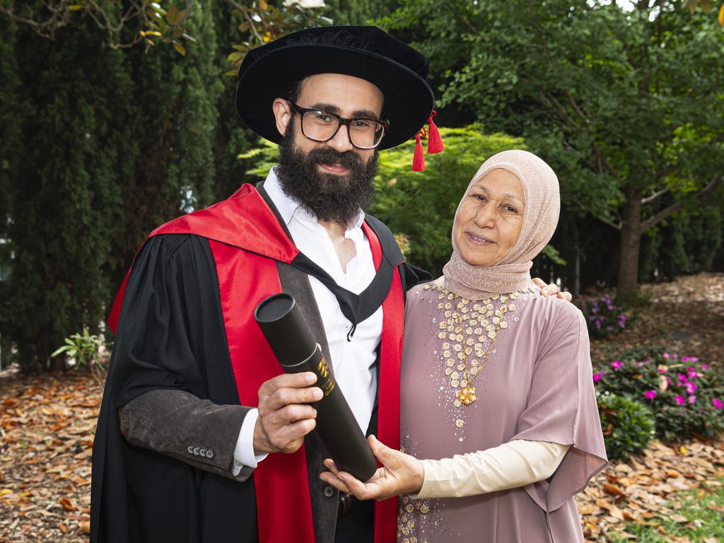 PhD graduate Basem Aly is congratulated by mum Samia Elhabab at a UniSQ graduation ceremony at The Empire, Wednesday, October 30, 2024. Picture: Kevin Farmer