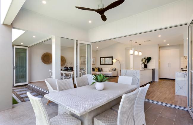 The internal living areas span the full width of the rear of the house, creating a seamless flow between alfresco area and the backyard