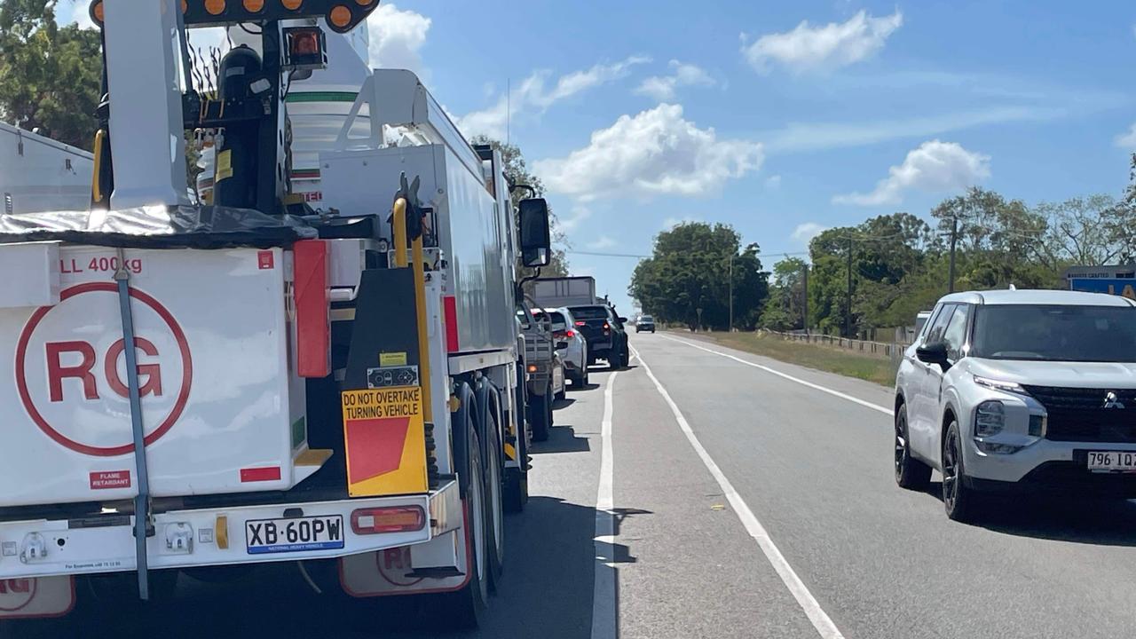 Bruce Highway split in two as fireys battle blaze