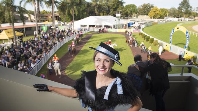 Lauretta Lewis stands high above the parade ring on South Grafton Cup Day after being named the Lady of the Carnival in the Fashions on the Field competition.