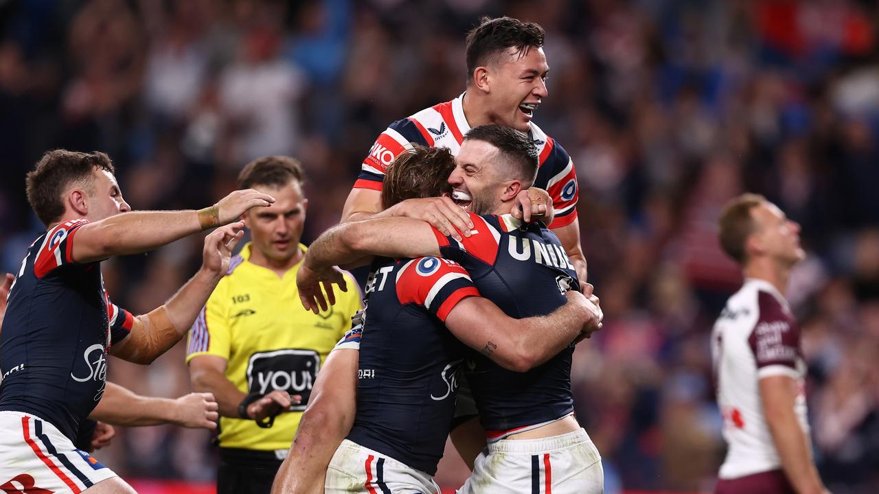 SYDNEY, AUSTRALIA - SEPTEMBER 21: James Tedesco of the Roosters celebrates with team mates after scoring a try during the NRL Semi Final match between Sydney Roosters and Manly Sea Eagles at Allianz Stadium on September 21, 2024 in Sydney, Australia. (Photo by Jason McCawley/Getty Images)