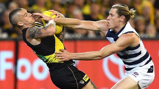 Dustin Martin of the Tigers marks in front of Mark Blicavs of the Cats during the AFL Preliminary Final on September 20, 2019.