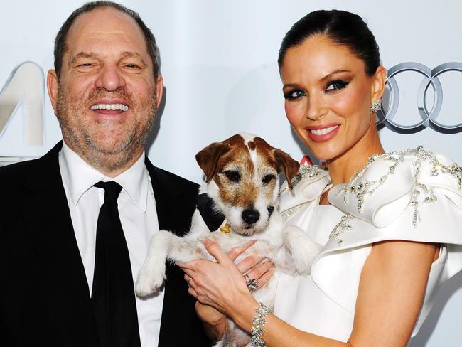 Harvey Weinstein, Uggie the dog and designer Georgina Chapman. Picture: Getty