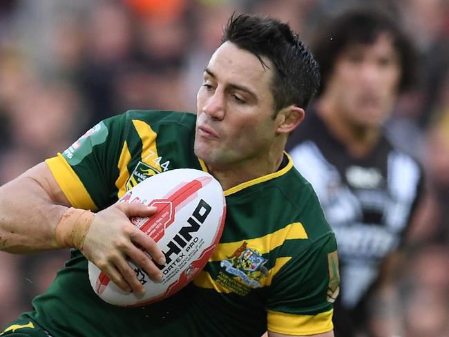 Australia's srum-half Cooper Cronk (R) is tackled by New Zealand's wing Jordan Rapana during the rugby league Four Nations Final match between Australia and New Zealand at Anfield in Liverpool, north west England on November 20, 2016. / AFP PHOTO / Paul ELLIS / RESTRICTED TO EDITORIAL USE