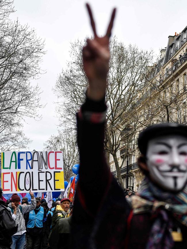 A protester holds a placard reading "France in anger".