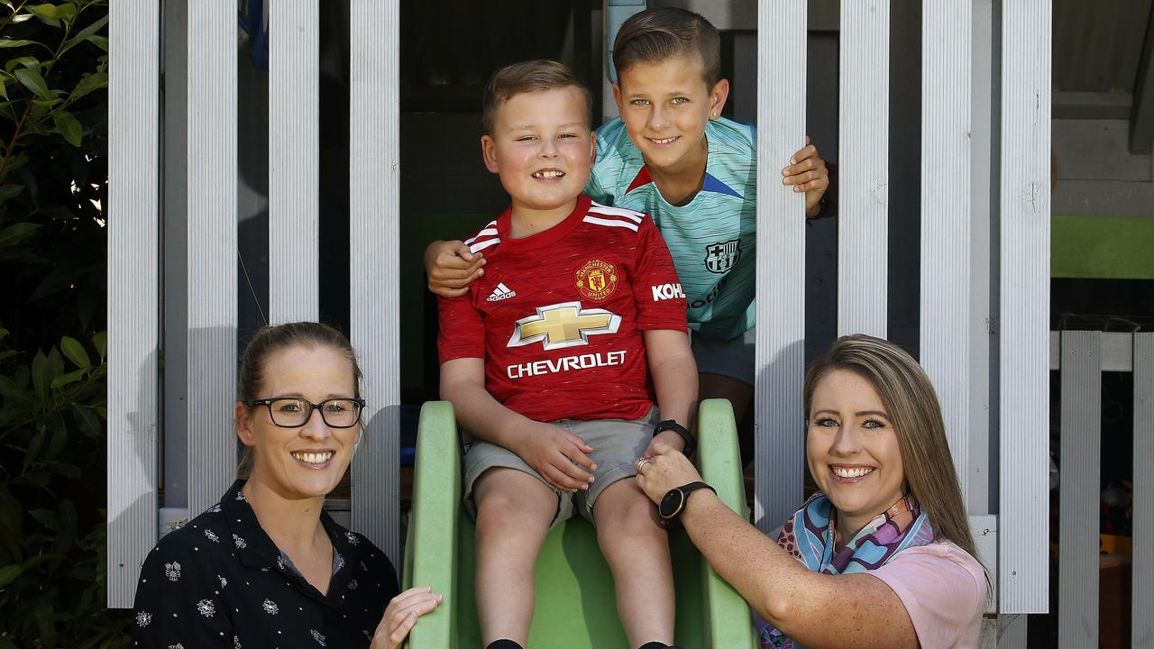 Tommy Adams-Bennett (middle) with his mums Dani and Amanda Adams-Bennett and brother Lachie. Picture: John Appleyard