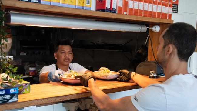 Staff preparing meals for customers dining in at Speedo's Cafe, Bondi Beach. Picture: AAP Image/James Gourley