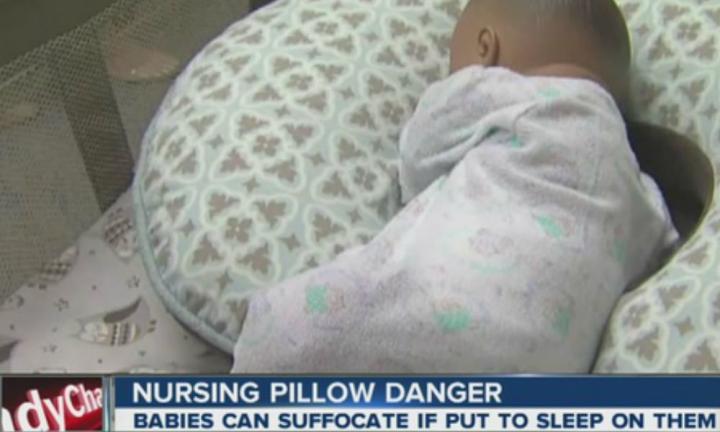 Baby sleeping sale on nursing pillow