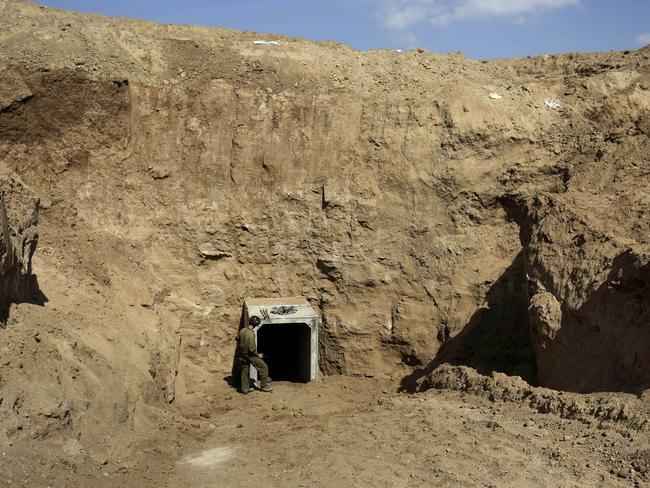 An Israeli soldier stands at the exit of a tunnel discovered near the Israel Gaza border. Picture: Tsafrir Abayov