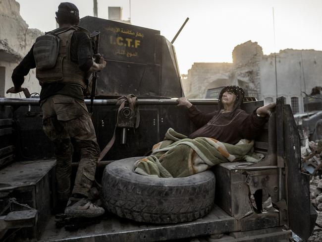 Rasmus Flindt Pedersen’s Mosul Liberated shows an elderly woman being driven through the city on the back of one of Golden Division’s Humvees. The temperature is nearly 50 degrees and she’s too weak to get away from the frontline on her own. Source: Supplied