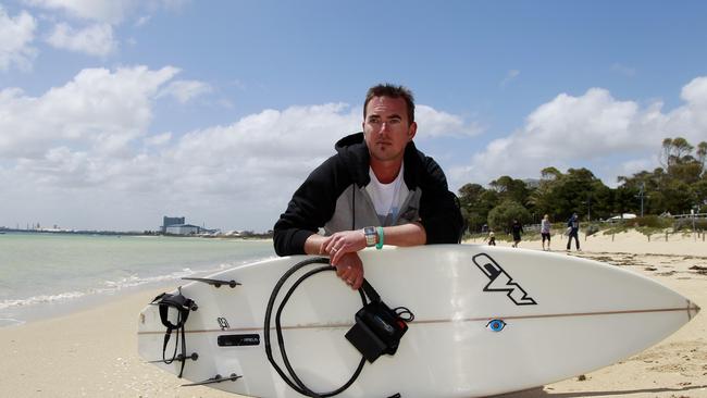 WA man Rick Gerring, who lost his brother in a 2016 shark attack at Rockingham Beach, pictured with his surfboard kitted with a Surf Shield shark repellent device