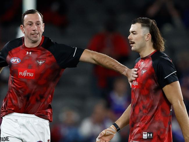 MELBOURNE, AUSTRALIA – APRIL 12: Todd Goldstein (left) and Sam Draper of the Bombers warm up during the 2024 AFL Round 05 match between the Western Bulldogs and the Essendon Bombers at Marvel Stadium on April 12, 2024 in Melbourne, Australia. (Photo by Michael Willson/AFL Photos via Getty Images)