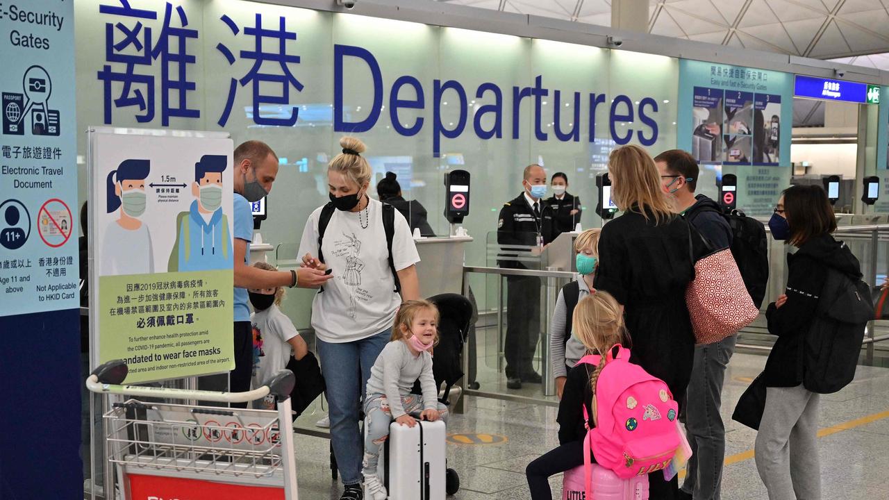 Expat families departing Hong Kong's international airport, as travel restrictions hit hard on the city's white collar foreign workers, who make up roughly 10 per cent of the population. Picture: AFP.