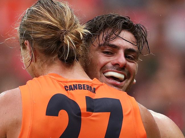 Giants Stephen Coniglio celebrates kicking a goal  with Harry Himmelberg during AFL match between the GWS Giants and Essendon at Giants Stadium. Picture. Phil Hillyard