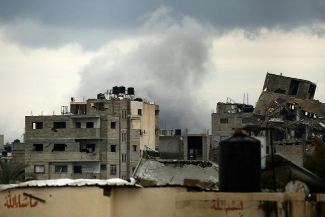 Smoke billows after an Israeli strike near the Bureij refugee camp in the central Gaza Strip