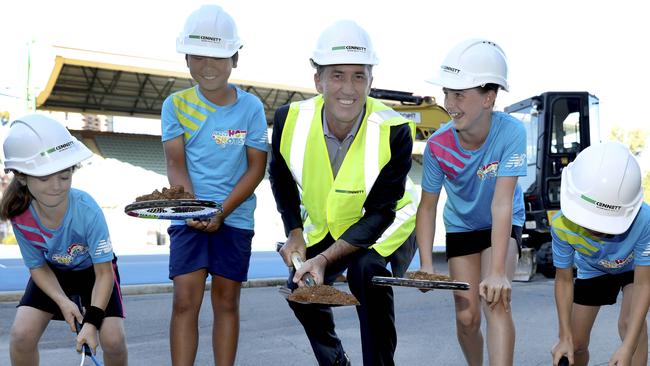 Darren Cahill helps to launch the construction of the new Memorial Drive tennis complex with young tennis players Eliza, Ian, Jordyn and Adon. Picture: Dean Martin