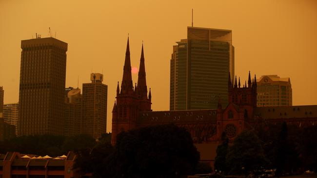 An eerie glow over Sydney this week. Picture: Cameron Spencer/Getty Images