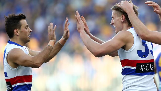 Sam Lloyd has formed a solid combination with young big forward Aaron Naughton. Picture: AAP