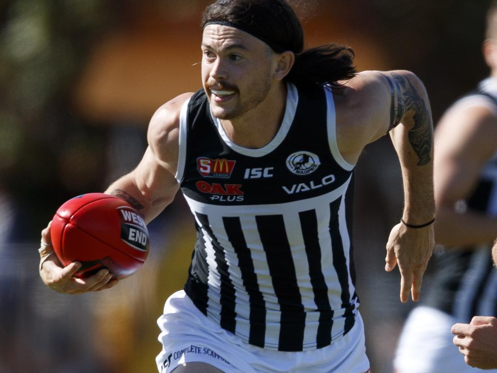 25/4/18 SANFL: Sturt v Port Adelaide at Unley Oval. Jasper Pittard of the Magpies evades the tackle from Guy Page of Sturt. Picture MATT TURNER.