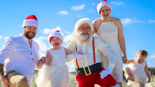 Paige Skarratts with parents Jake and Tania, sister Imogen and Santa last Christmas. Picture:  NATURALLY CREATIVE PHOTOGRAPHY.