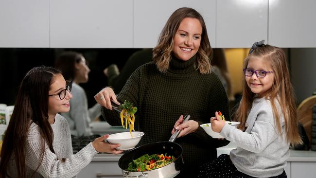 Leonni Mazomenos likes to have supplies ready to make quick, healthy meals for her daughters Tiana and Chloe. Picture: Calum Robertson