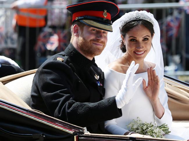 Prince Harry, Duke of Sussex and Meghan Markle wave from the Ascot Landau Carriage during their carriage procession on Castle Hill. Picture: Getty Images